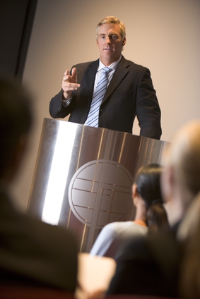 Businessman giving presentation at podium